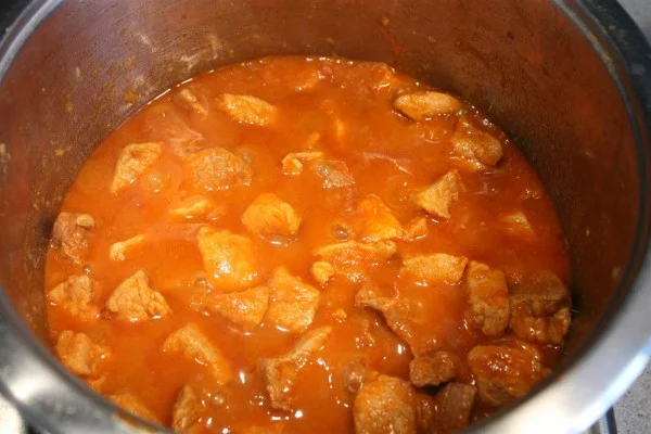 Cook the porkolt until meat becomes tender