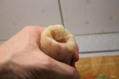Stuff the loose end with your forefinger