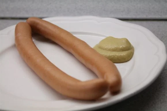 Boiled hot dog with mustard