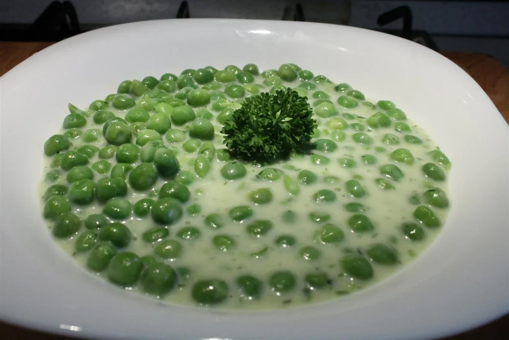 Green pea stew in plate
